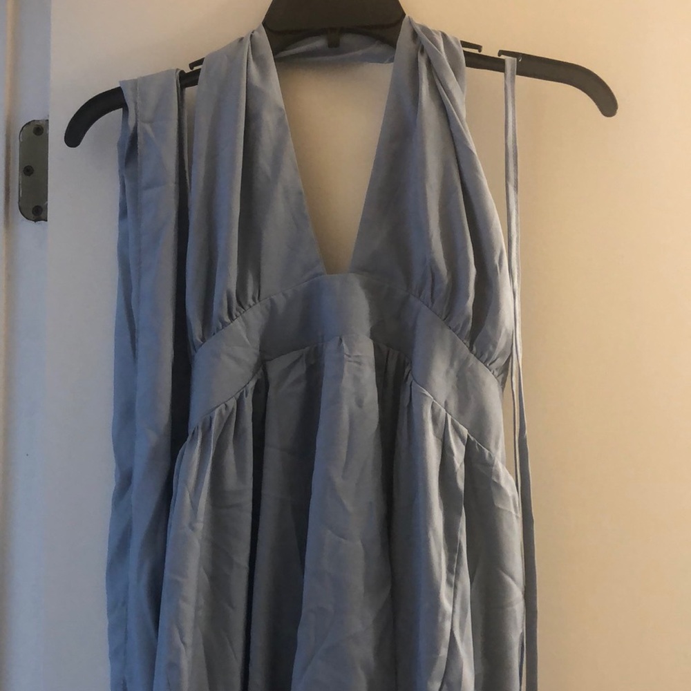 Halter sky blue dress with optional sash or string tie. Zipper back.